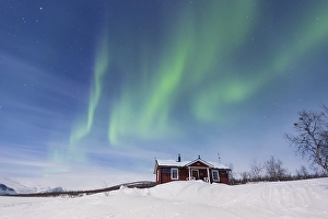 Category Scandinavia Prints: Northern Lights (Aurora borealis) above a Swedish red house in winter