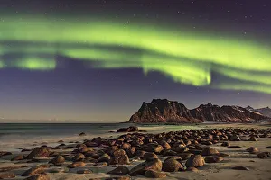 Northern lights (Aurora borealis) in winter Scandinavian landscape