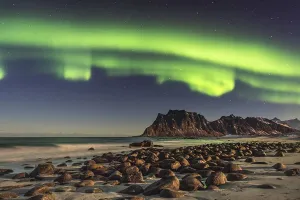 Northern lights (Aurora borealis) in winter Scandinavian landscape