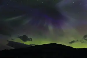 Northern lights at dawn over Sorfolda Fjord near Kjerringoy between Bodo