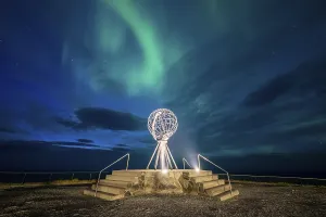 Northern Lights at the North Cape with steel globe