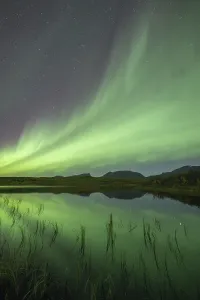 Northern lights reflected in lake