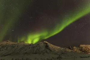 Northern Lights over snow covered mountains