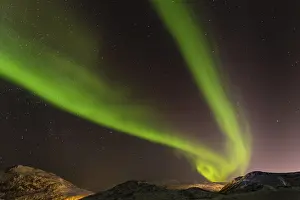 Northern Lights over snow covered mountains