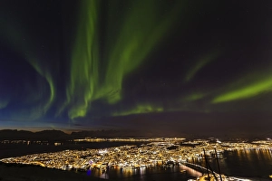 Northern Lights over Tromso, view from mountain Storsteinen