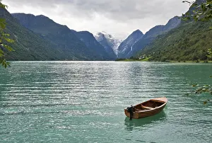 Framed Print : The Norwegian landscape with a boat on lake against mountains
