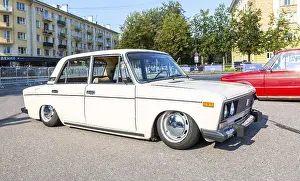 Novgorod, Russia - August 31, 2024: Vintage soviet tuned Lada-2103 lowered suspension vehicle at the city street