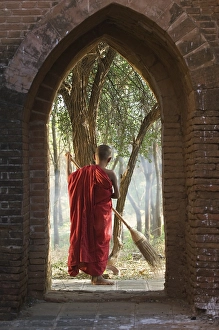 Category Buddhism Prints: Novice Buddhist monk sweeping, Bagan