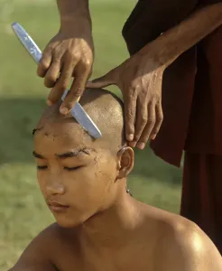 Category Buddhism Prints: Novice having his hair shaved, Amarapura