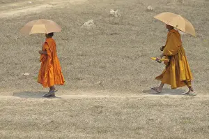 Novice and a monk with sunshades, Cambodia, Asia