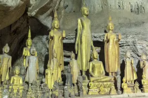 Numerous Buddha statues in Pak Ou Cave