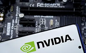 Category Historic EN Prints: NVIDIA logo on phone and blurred chip on the background-Dhaka