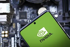 Category Historic EN Prints: NVIDIA logo on phone and blurred chip on the background-Dhaka