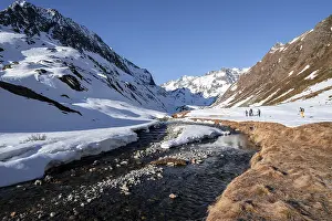 Oberbergbach in winter with snow-covered mountain landscape