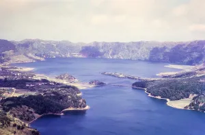 Oblique aerial view of Lagoa Azul and Lagoa verde, blue and green lake, Lagoa das Sete Cidades, Sao Miguel Island, Azores, Portugal, April 1964, Europe