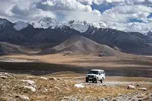 Category Mountain Landscapes Prints: Off-road vehicle on a gravel track