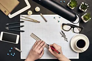 Office desk background hand with pen writing construction project ideas concept