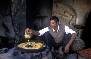 Faces Of The World Prints: Oil baker preparing sweet pastries