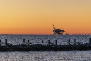 Oil and gas drilling rigs on the Gulf of Mexico horizon at Fort Morgan