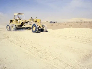 Oil industry in the Dhahran area, Saudi Arabia, heavy vehicles and machinery building roads in the Arabian desert, 1979, Asia