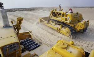 Oil industry in Ras Tanura area, Saudi Arabia, D6H caterpillar bulldozer desert construction 1979, Asia