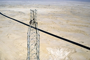 Oil industry in the Ras Tanura region, Saudi Arabia, 1979 Men building a drilling rig in the desert, Asia