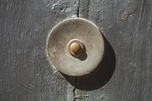 Old bell on a half-timbered house in the old town centre