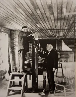 Old black and white photo, Thomas Edison and Jehr reenactment of the evacuation of an experimental light bulb