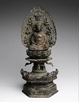 Old Buddha sculpture, bronze, Buddha sitting on a throne