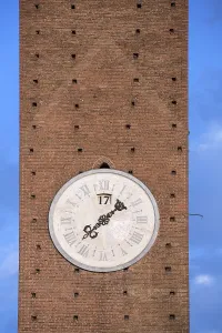 Old clock tower in the medieval city of Siena