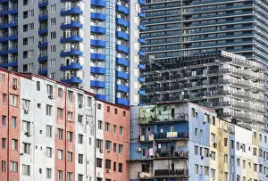 Old high-rise building behind it modern high-rise buildings