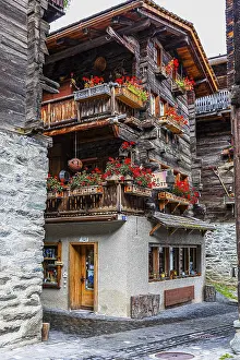 Old house decorated with flowers in the historic village centre