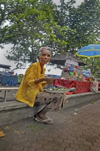 Old lady selling drinks near Amed, Bali, Indonesia, Asia