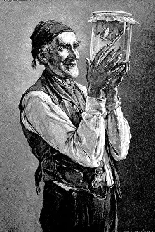 Old man holding a glass with a weather frog and predicting good weather