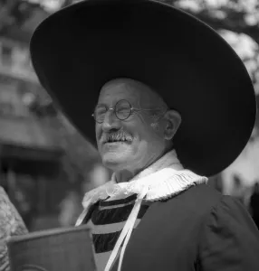 Old man with very large hat, carnival