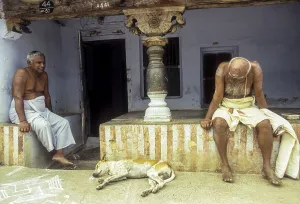 Two old man sitting in front of the Agraharam house at Sengottai near Courtalam Kutralam Kuttalam