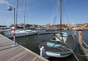 Old sailing boat in the harbour at a jetty