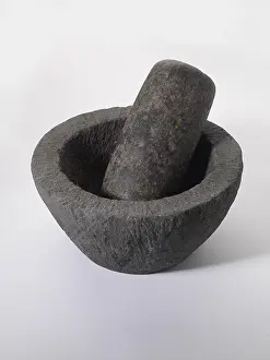Old stone grinder on white background