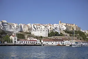 Old town and boats in the natural harbour of Mao