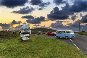 Old VW bus, vintage car, next to direction signs to St Just