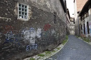 Old wall covered in graffiti in the historic centre of Erfurt