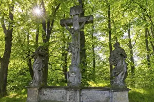 Old Way of the Cross with a group of figures of Christ on the Cross
