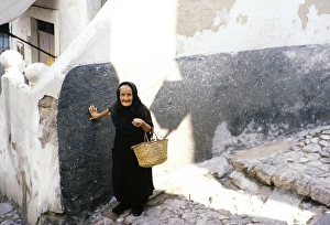 Old widow in black clothes in Ibiza Town, Ibiza, Balearic Islands, Spain 1967