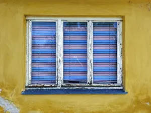 Old window with white blinds in front of a yellow wall Unterretzbach Weinviertel Lower Austria Austria