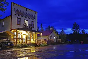 Old wooden hotel from the 1920s and a vintage car in the blue hour