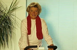 Older woman on the exercise bike Fitness