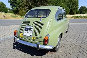 Olive green classic car parked in daylight
