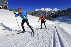 Fascination Winter Sport Prints: Olympic silver medalist Tobi Angerer with his wife Romy on the cross-country ski trail of Winklmoos-Alm
