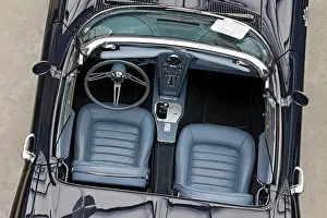 Open convertible car, two blue leather seats