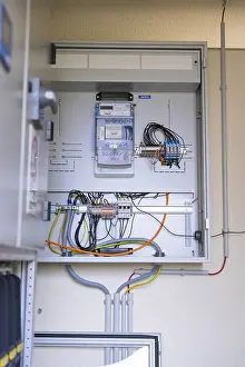 Category Historic EN Prints: Open electrical box with numerous wires and technical equipment